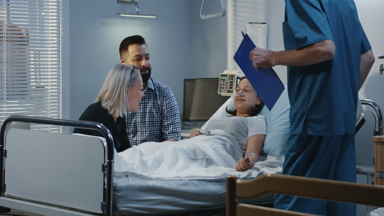 Family Visiting a Sick Teenager in Hospital
