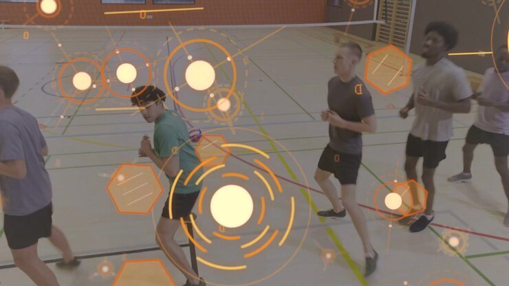 On drill cue five men doing sports footwork training with pulsing orange graphics overlaying group