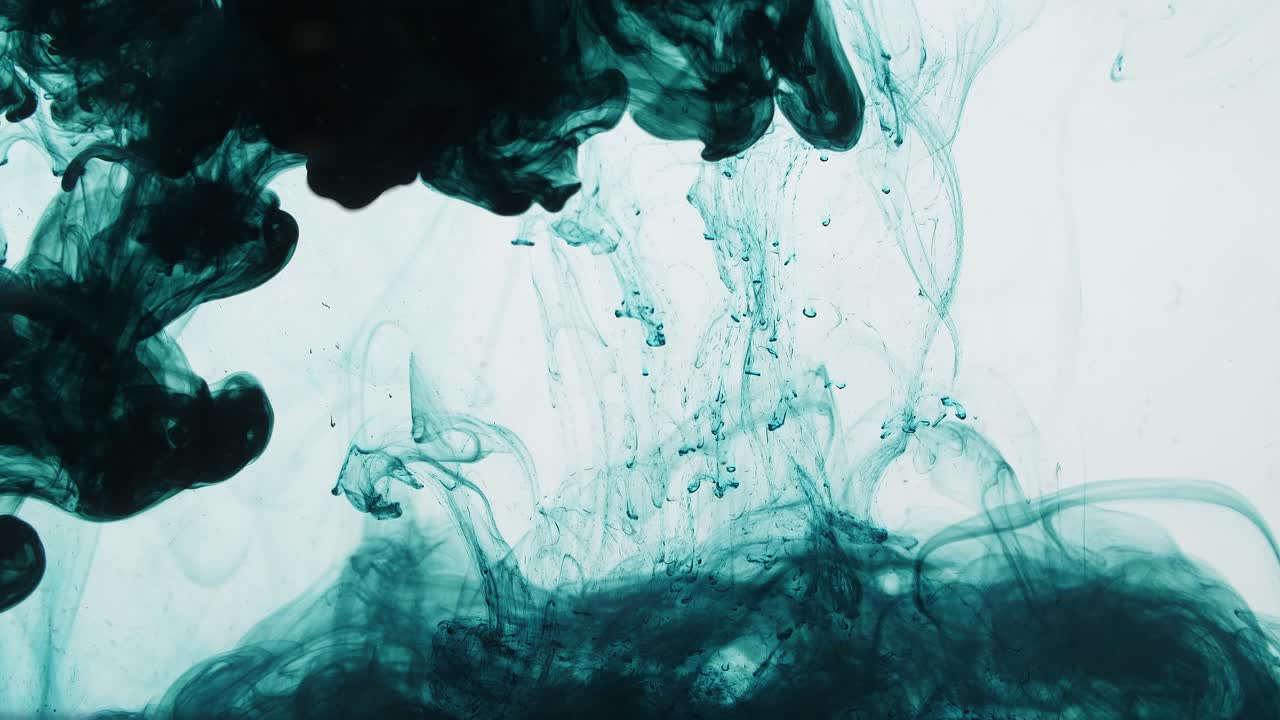 Dark Green Ink Drop Into Water On A White Background