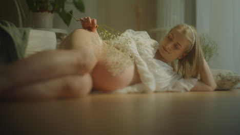 expectant woman with baby's breath on belly