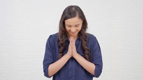 cute indian girl doing namaste