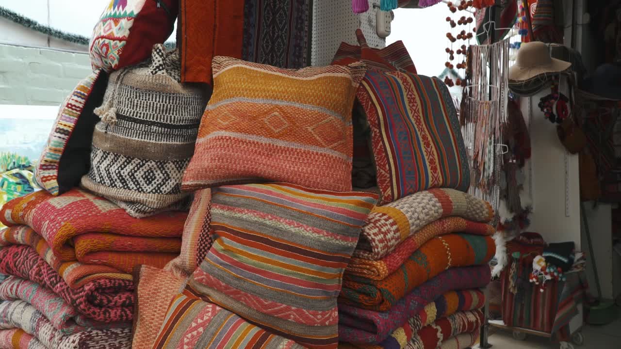 Pillow made with peruvian textiles at the Inka market in Lima, Peru