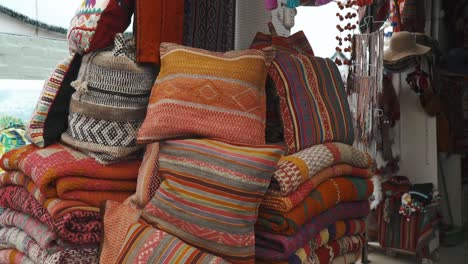 pillow made with peruvian textiles at the inka market in lima, peru
