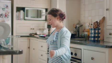 happy-teenage-girl-dancing-in-kitchen-having-fun-weekend-celebrating-at-home-with-funny-dance-moves-enjoying-playful-freedom