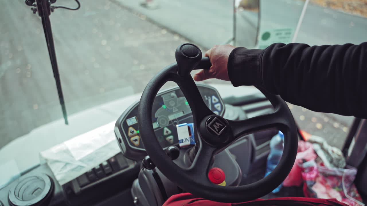 Cabin of the vibration road roller. View inside the cabin of the road equipment roller at construction site