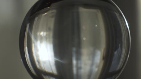 Sun-Flares-With-Shining-Through-Curtains-Viewed-Through-Lensball-Indoors