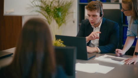 businessman discussing on video call in office.