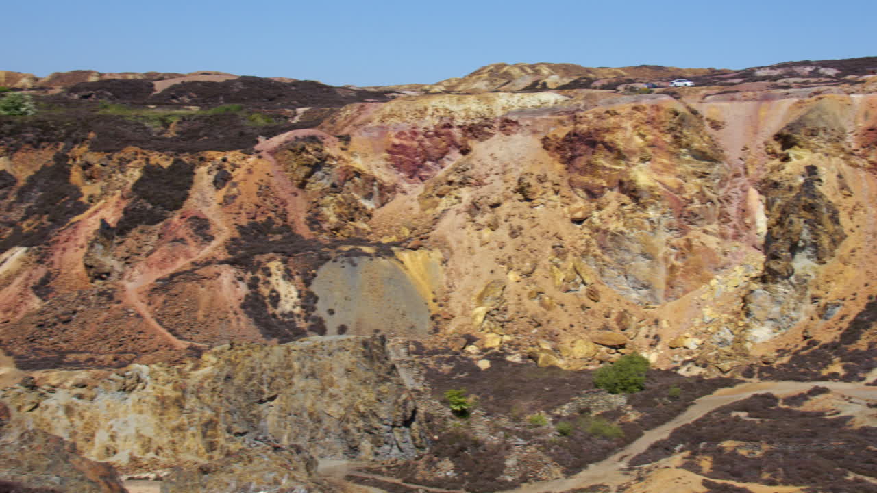 Extra Wide panning shot of the north side of the Great opencast mine at mynydd parys mountain copper mine