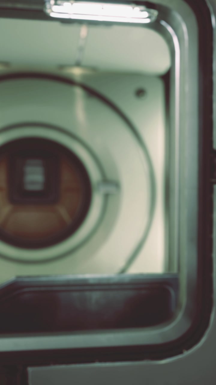 Close view of a washing machine drum during a laundry cycle in a home setting