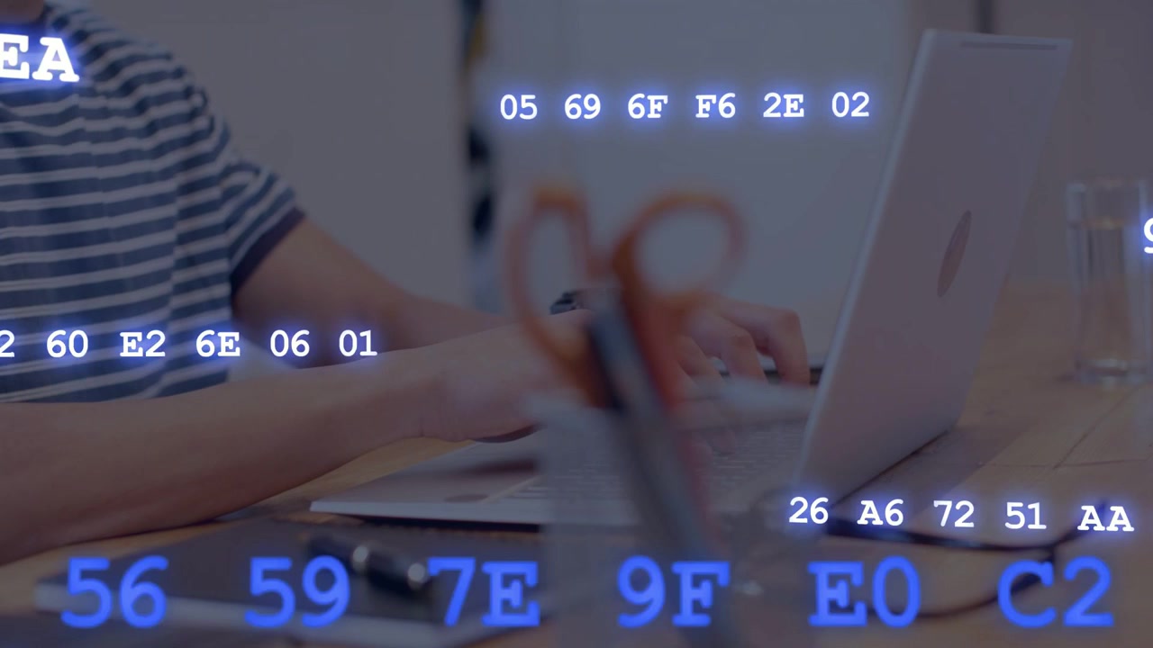 Male worker typing on laptop at desk, causing animated hex code overlay visualizing tech metrics