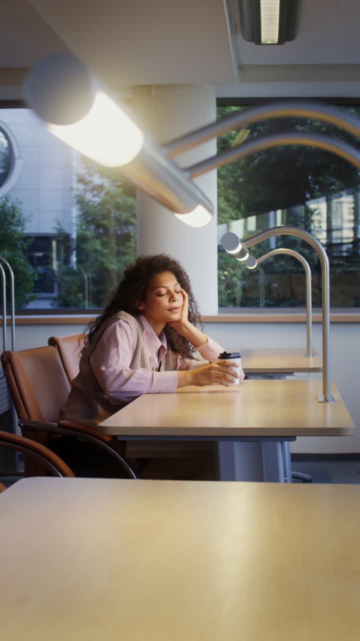 A woman sitting at a desk in an office