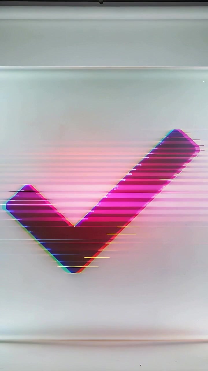 Vertical video: Appearing check mark glitching with RGB fringe, scanlines and pink glow on wall