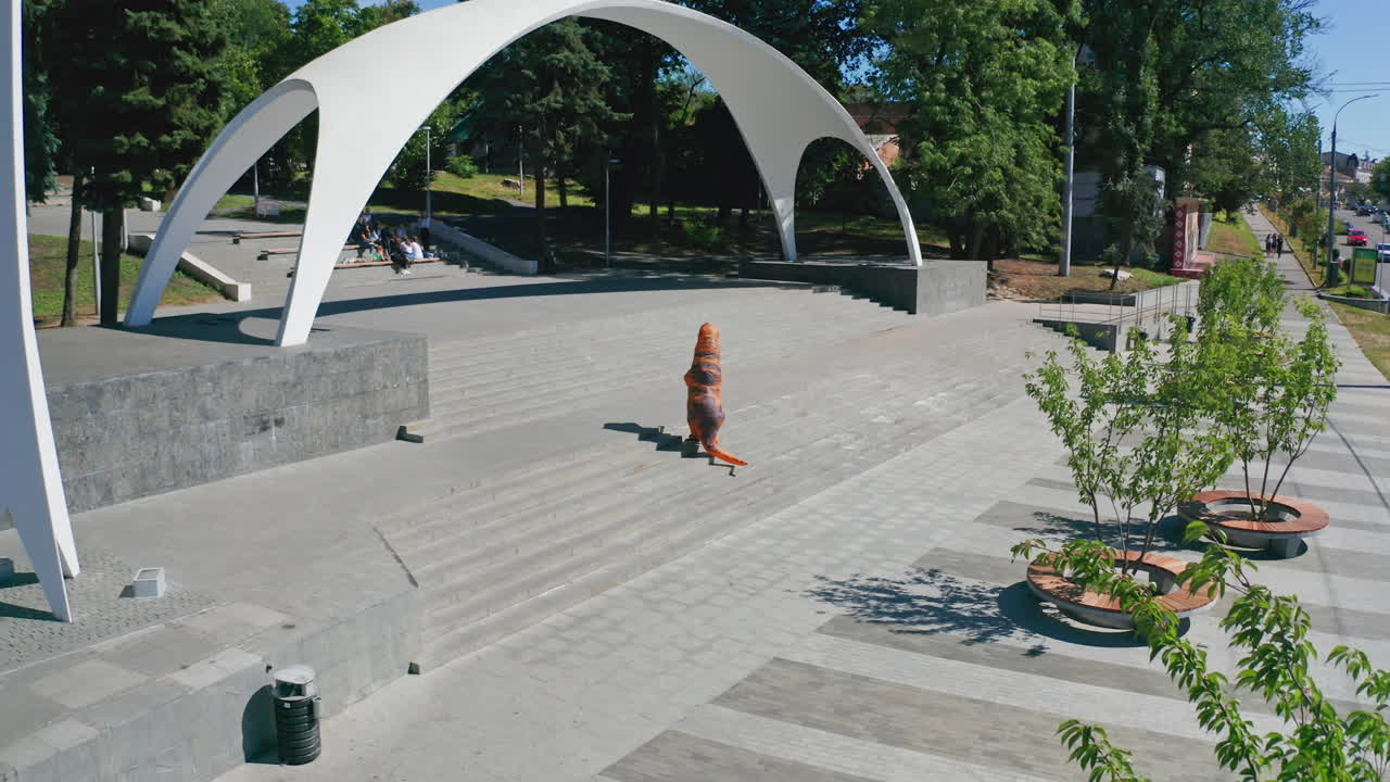 Person in Dinosaur Costume on Steps in Park