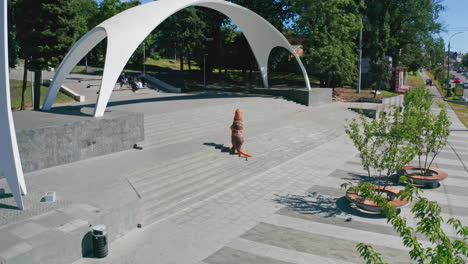 person in dinosaur costume on steps in park