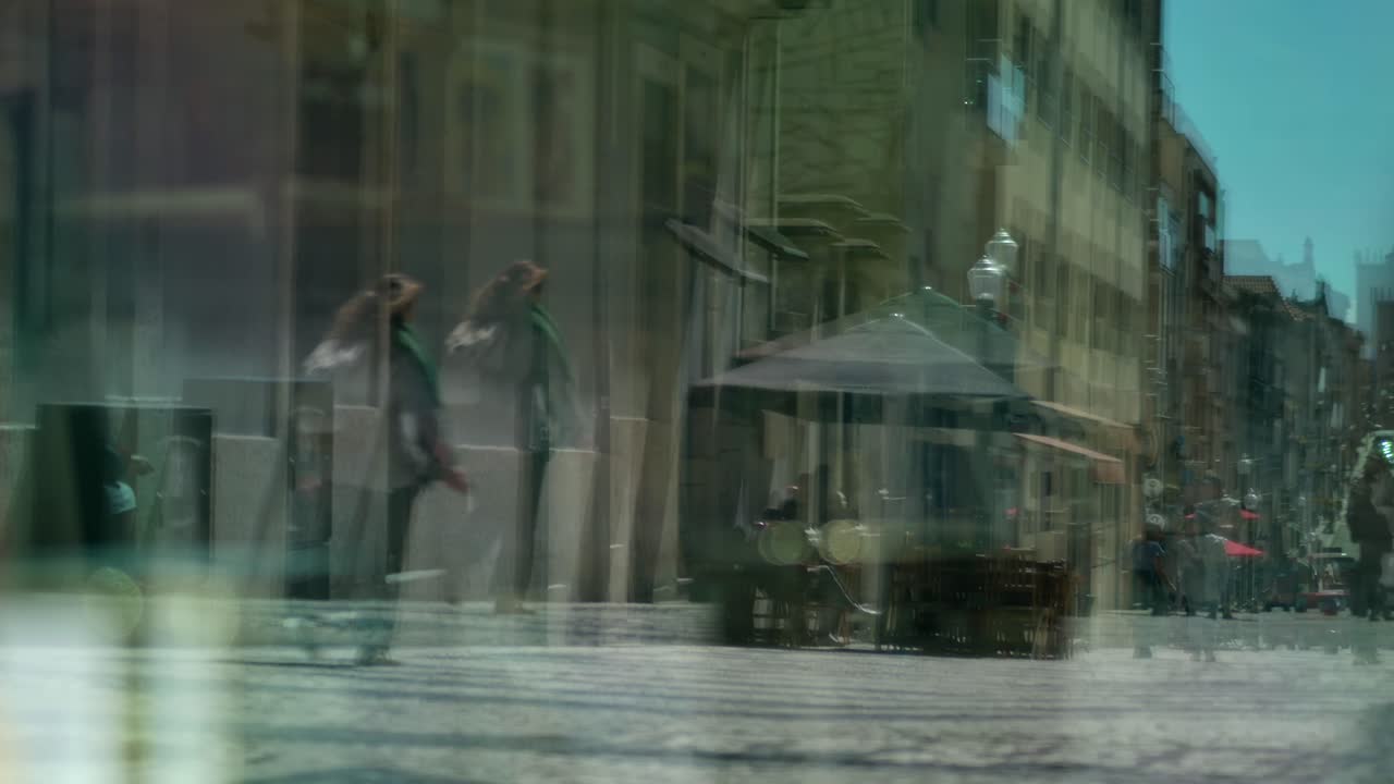 The reflexion of the street through a large window.