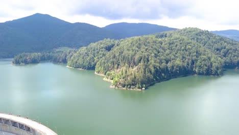 Aerial-Drone-Shot-of-the-Water-and-Mountains-of-Valea-Draganului