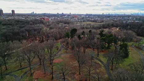 drone flying over kissena park in neighborhood of flushing in queens, new york city