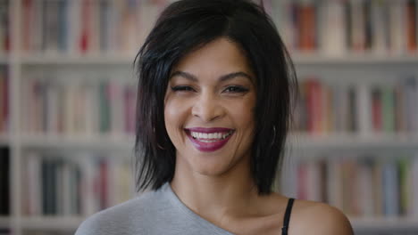 close up portrait attractive young hispanic woman laughing enjoying successful education lifestyle independent female student in library bookstore background slow motion