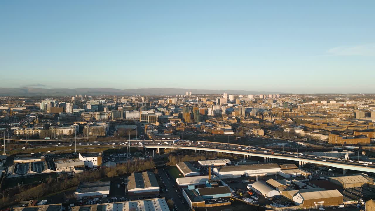 Aerial Rise of Glasgow City Centre In Background, During Golden Hour