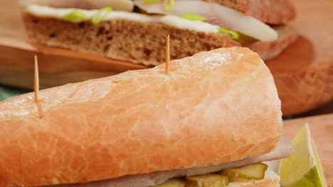delicious fish sandwiches on wooden board