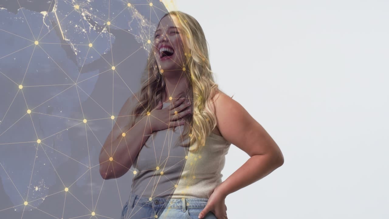 Woman laughing, hand on chest in studio, drifting globe causing arcs sweeping torso for tech