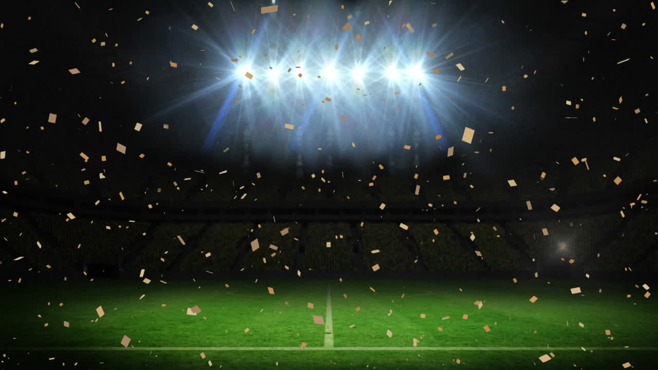 밤에 스포츠 스타디움에서 홍수 조명 피치 위에 떨어지는 콘페티의 애니메이션