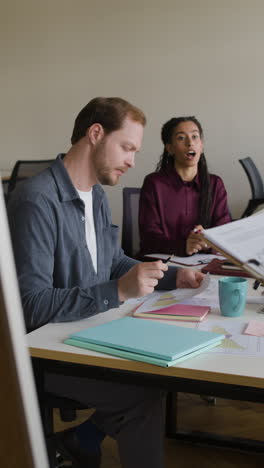 two colleagues attending a business meeting