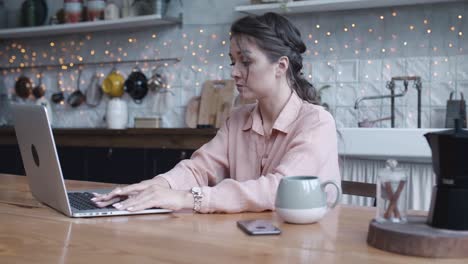 woman working from home in a cozy kitchen