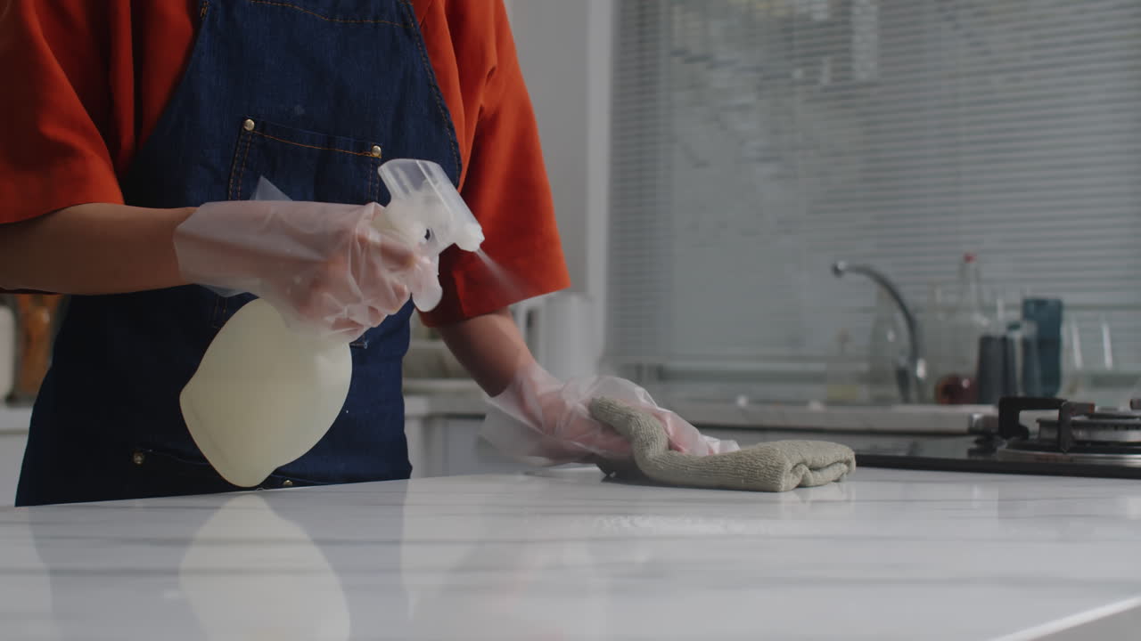 Unrecognizable Person Doing Cleaning of Kitchen Counter