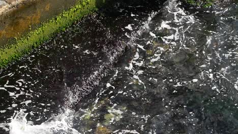 close up view of waves crashing on a rocky shore