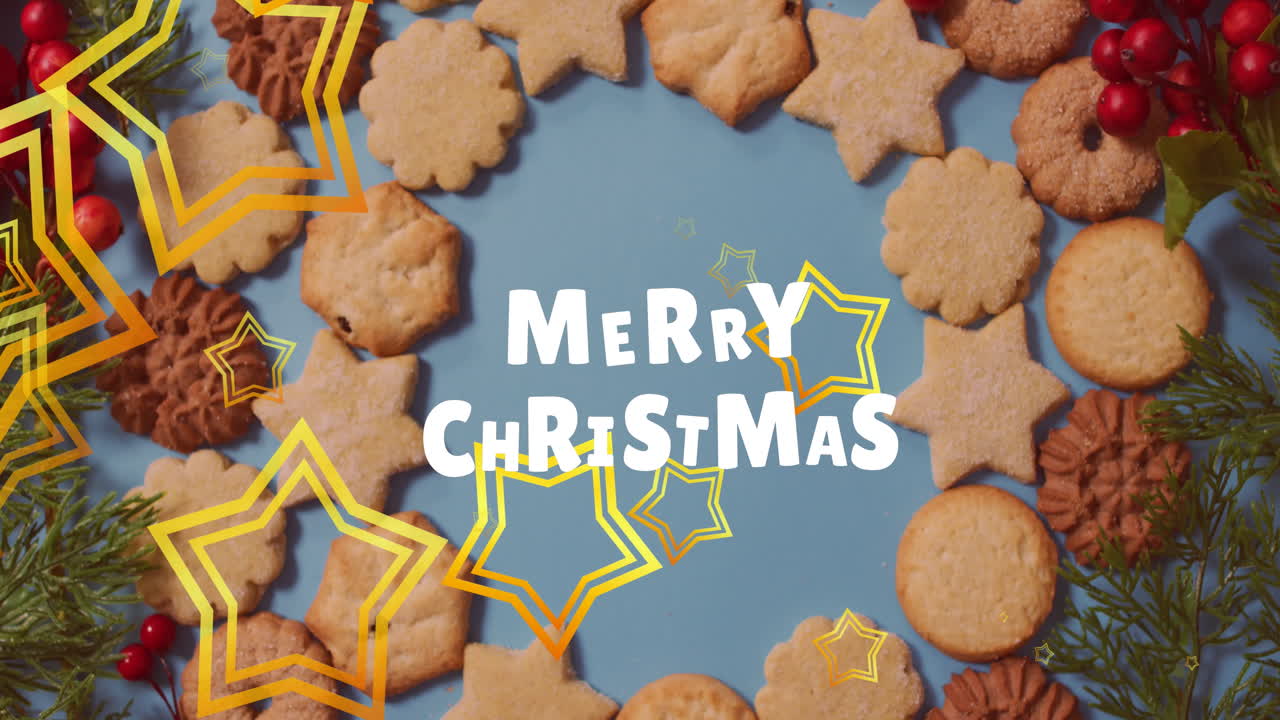 메리 크리스마스 텍스트 배너와 황금색 별 아이콘이 파란색 표면의 쿠키에 떠다니고 있습니다.