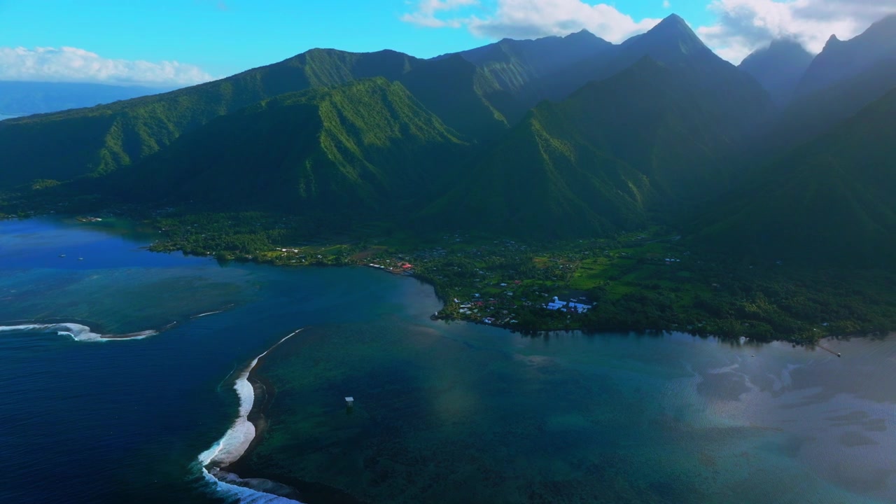 Teahupo'o wave coastline surf spot WSL tour sunny early morning Tahiti lagoon aerial drone landscape harbor view French Polynesia Passe Havea vibrant coral reef South Pacific Ocean island circle left