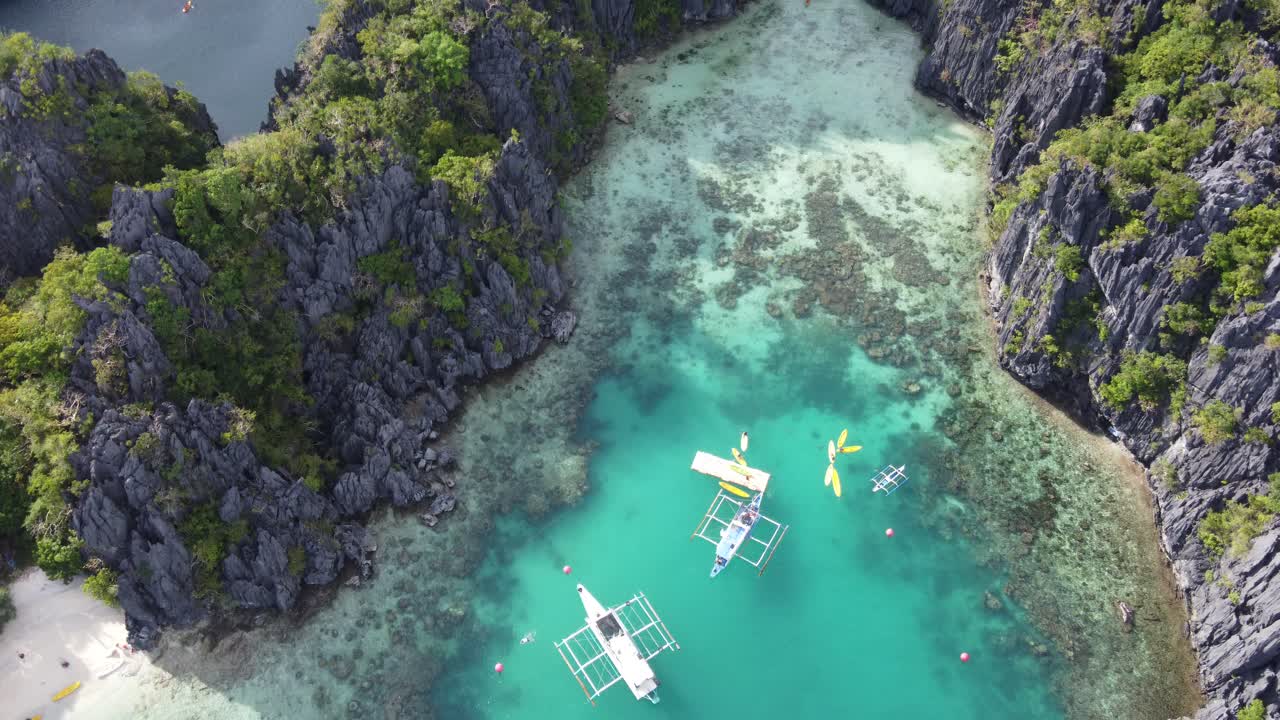 Scenic aerial over dramatic limestone karsts and Small Lagoon, El Nido Palawan