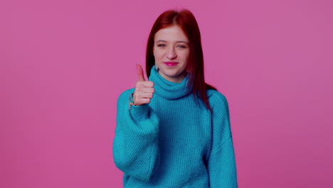 teenager girl raises thumbs up agrees or gives positive reply recommends advertisement likes good