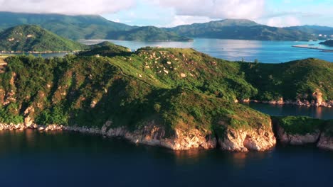 Cheung-Chau-amazing-lush-mountain-island-dense-tropical-peaks-aerial-rising-orbit-right-Hong-Kong-travel-destinations