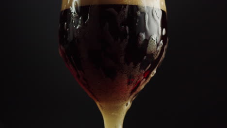 close-up of a glass of beer with foam