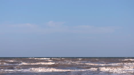 sea waves rushing at the beach