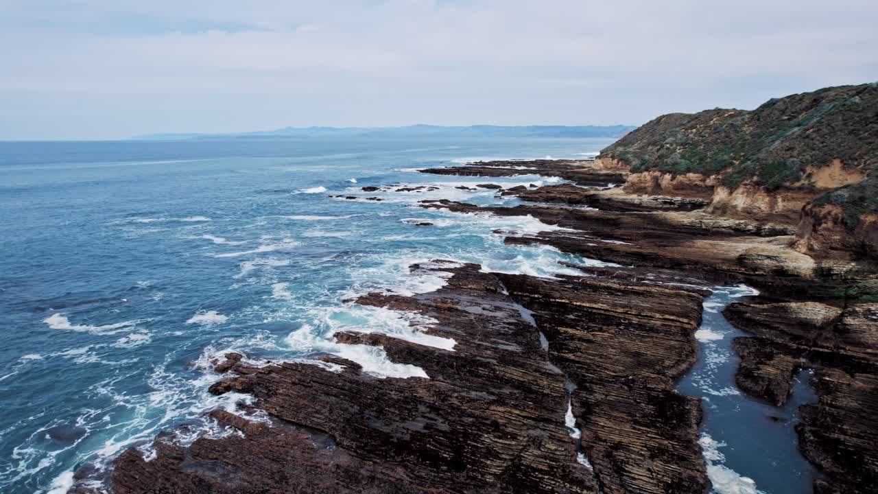 Dramatic Ocean Cliffs on the West Coast with Waves Crashing Against Rocks