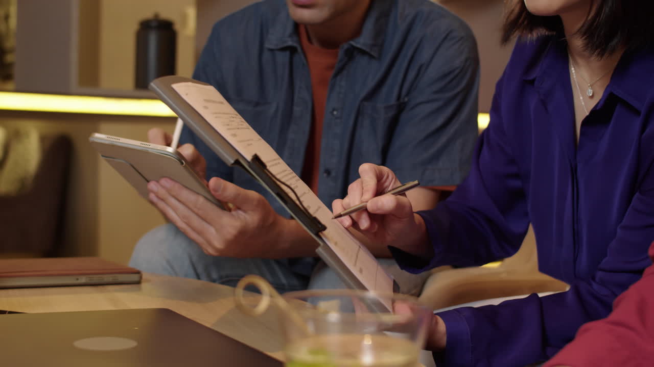 Businesspeople Gathering to Discuss Contract Details