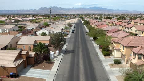 aerial rising over residential neighborhood homes in suburban las vegas desert