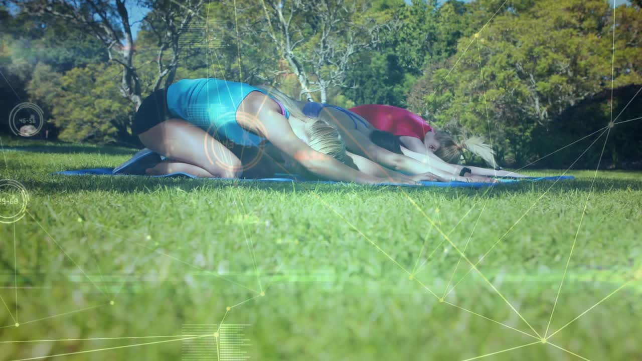 Three women pushing arms, lifting hips and arching chests on yoga mats in park with overlay