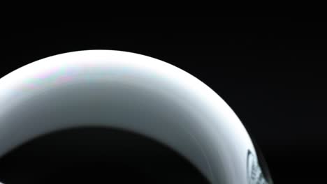 close-up view of a soap bubble showing dynamic color reflections and light interplay over 34 seconds