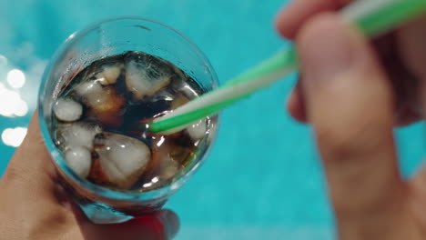 enjoying a refreshing drink by the pool