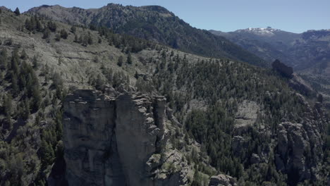 AERIAL---Rock-formations-next-to-Limay-River-in-Valle-Encantado,-Patagonia,-Argentina