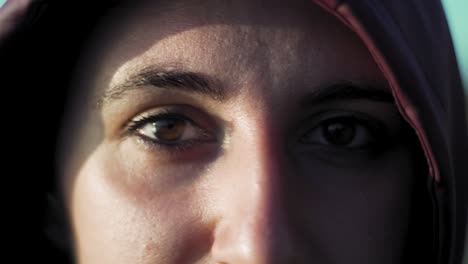 close up of eyes and face of natural caucasian girl looking at camera