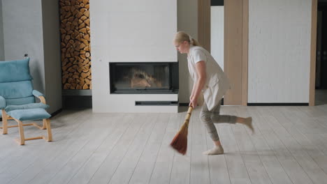 woman sweeping a modern living room