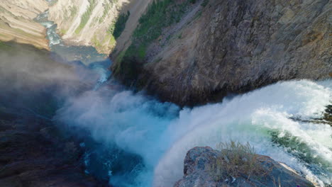grand waterfall plunging into a canyon