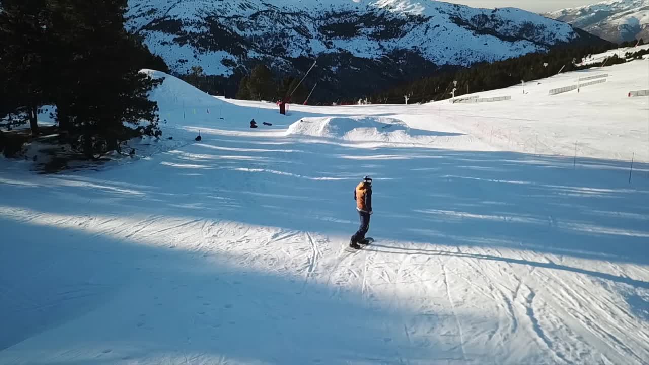 Snowboarder riding a Snow Park filmed with a Drone
