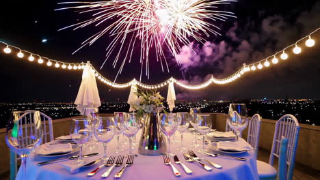 rooftop dinner party with fireworks