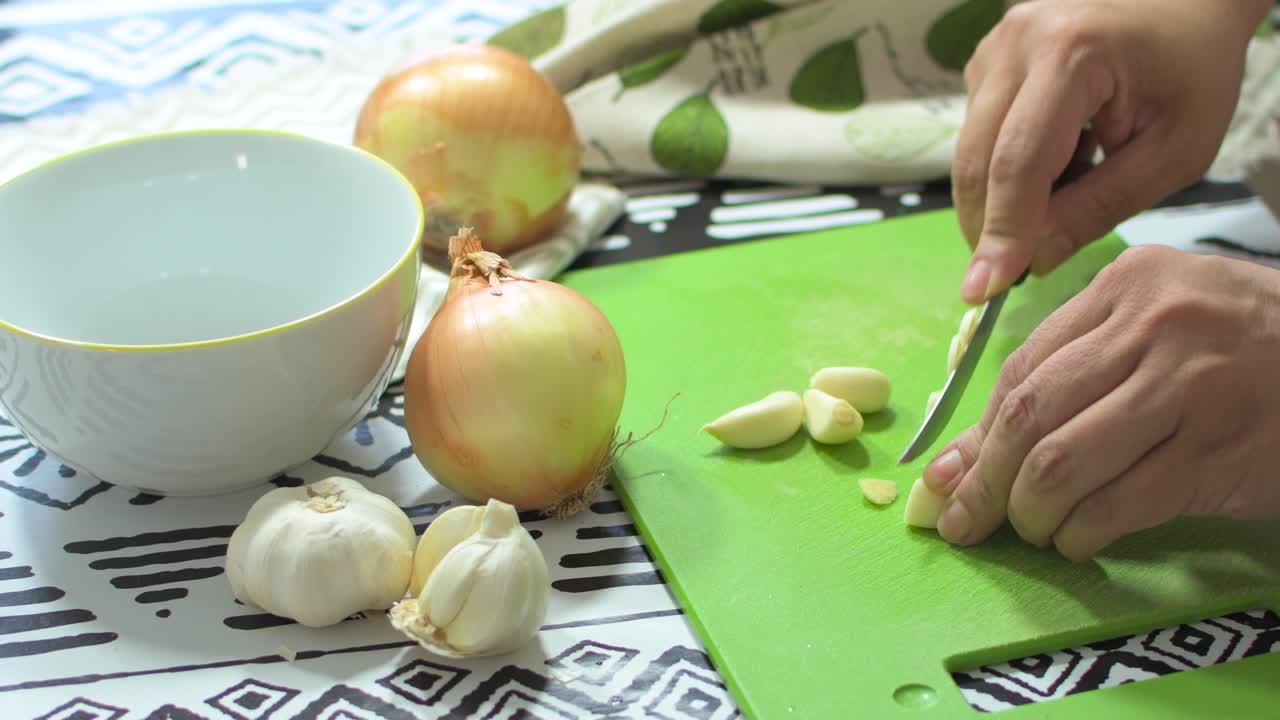 Chopping onions and garlic